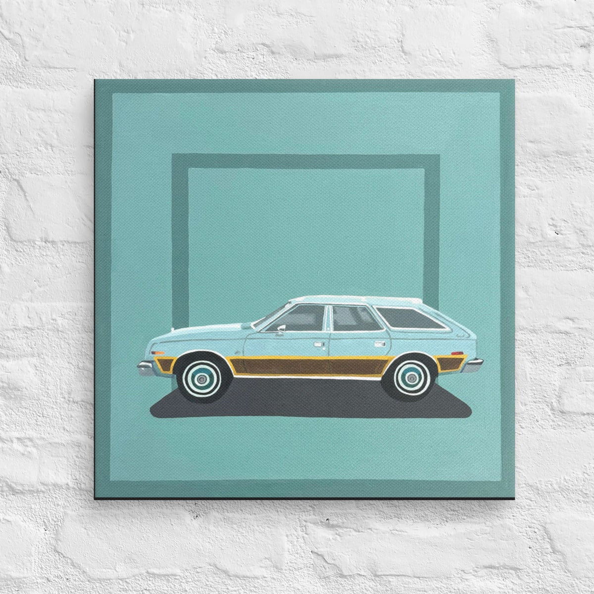A square framed art print featuring a retro light blue station wagon with a gold side stripe, displayed on a white brick wall.